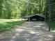 Garage and carport with vehicles and boat at 146 Barclay Ln, Mooresville, NC 28115