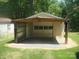 Detached garage with open parking and door into backyard at 146 Barclay Ln, Mooresville, NC 28115