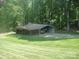 Garage and carport with vehicles and boat at 146 Barclay Ln, Mooresville, NC 28115