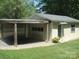 Detached garage with open parking and door into backyard at 146 Barclay Ln, Mooresville, NC 28115
