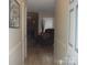 View down the hallway featuring hardwood floors, fresh paint, and an inviting entryway at 146 Barclay Ln, Mooresville, NC 28115