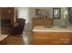 Spacious and inviting kitchen showcasing the breakfast bar and easy access to the adjacent rooms at 146 Barclay Ln, Mooresville, NC 28115