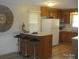 Well-lit kitchen featuring a breakfast bar that provides seating and hardwood floors at 146 Barclay Ln, Mooresville, NC 28115