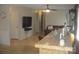 Inviting living room featuring a bamboo bar, adjacent leather couch, and a ceiling fan for added comfort at 146 Barclay Ln, Mooresville, NC 28115