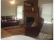 The living room features hardwood floors, fresh paint, brick fireplace and a mounted fish at 146 Barclay Ln, Mooresville, NC 28115