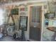 Enclosed patio features decorations, a door and screened windows at 146 Barclay Ln, Mooresville, NC 28115