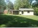 The property features a well-maintained shed with a covered area, perfect for storage at 146 Barclay Ln, Mooresville, NC 28115