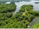 Stunning aerial view of a lake community with lush greenery and docks at 146 Paradise Peninsula Rd, Mooresville, NC 28117
