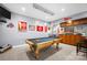 Finished basement featuring a pool table, bar, and Ohio State Buckeyes themed decorations at 146 Paradise Peninsula Rd, Mooresville, NC 28117