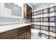 Bathroom features a modern vanity with marble countertop and a shower with a striped curtain at 146 Paradise Peninsula Rd, Mooresville, NC 28117