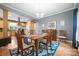 Cozy dining room features hardwood floors, modern lighting, and an open layout to the kitchen at 146 Paradise Peninsula Rd, Mooresville, NC 28117