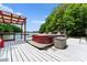 Boat on a covered dock with lake views and lush greenery at 146 Paradise Peninsula Rd, Mooresville, NC 28117
