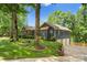 Blue home with well-manicured lawn and a detached two car garage at 146 Paradise Peninsula Rd, Mooresville, NC 28117