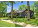 Charming home with well-maintained lawn and mature trees, showcasing a serene setting at 146 Paradise Peninsula Rd, Mooresville, NC 28117