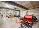Large garage with ample space for equipment and tools, featuring multiple garage doors at 146 Paradise Peninsula Rd, Mooresville, NC 28117