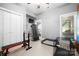 Spacious home gym equipped with workout bench, treadmill, weights, and natural light at 146 Paradise Peninsula Rd, Mooresville, NC 28117