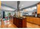 Open kitchen with a large center island and modern vent hood, opening into the dining area at 146 Paradise Peninsula Rd, Mooresville, NC 28117