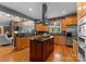 Open kitchen featuring a center island with gas cooktop, stainless appliances, and light wood cabinets at 146 Paradise Peninsula Rd, Mooresville, NC 28117