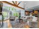Open living space boasts vaulted ceilings, natural light, hardwood floors, and seamless kitchen access at 146 Paradise Peninsula Rd, Mooresville, NC 28117