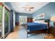 Serene main bedroom with a ceiling fan and access to a private balcony overlooking nature at 146 Paradise Peninsula Rd, Mooresville, NC 28117