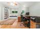 Bright office space with hardwood floors, built-in shelving, and a comfortable window seat at 146 Paradise Peninsula Rd, Mooresville, NC 28117