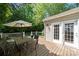 Back deck area perfect for relaxation, featuring a dining table and easy access to the home at 14625 Lyon Hill Ln, Huntersville, NC 28078