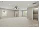 Large bedroom with neutral paint, carpet, and windows at 14625 Lyon Hill Ln, Huntersville, NC 28078