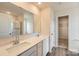 Bathroom featuring double vanity, white countertops, modern fixtures, and a walk-in closet at 151 Astor St, Troutman, NC 28166