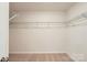 Walk-in closet with wire shelving and ample storage space with carpeted floors at 151 Astor St, Troutman, NC 28166