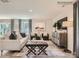 Bright living room with neutral palette, stylish furniture, and decorative rug for a cozy gathering space at 151 Astor St, Troutman, NC 28166