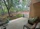 Private backyard with patio space, mature trees, and a charming white picket fence at 15318 Coventry Court Ln, Charlotte, NC 28277