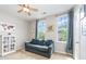 Comfortable bedroom with two windows, a sofa, and natural light, perfect for relaxation or a guest room at 15318 Coventry Court Ln, Charlotte, NC 28277