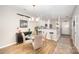 Charming dining area featuring a glass table and an open view of the kitchen at 15318 Coventry Court Ln, Charlotte, NC 28277
