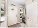 Charming entryway featuring a white front door, transom window, and elegant decor at 15318 Coventry Court Ln, Charlotte, NC 28277