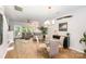 Open-concept living room features a comfortable sofa, large windows, and neutral decor at 15318 Coventry Court Ln, Charlotte, NC 28277
