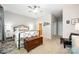 Spacious main bedroom with a ceiling fan, and dark wood chest, creating a cozy and functional retreat at 15318 Coventry Court Ln, Charlotte, NC 28277