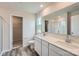 Bathroom with double sink vanity, large mirror, and glass-enclosed shower at 155 Astor St, Troutman, NC 28166