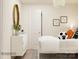 Bright bedroom featuring contemporary decor, a dresser with an oval mirror, and a comfortable bed with soccer ball accent at 155 Astor St, Troutman, NC 28166