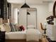 Tastefully decorated bedroom featuring a full length mirror, decorative dinosaur skull, and modern desk at 155 Astor St, Troutman, NC 28166