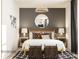 Well-lit main bedroom featuring a decorative mirror, stylish lamps, decorative pillows, and woven baskets at 155 Astor St, Troutman, NC 28166