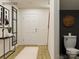 Bright foyer with wood flooring and a decorative hall table next to powder room at 155 Astor St, Troutman, NC 28166