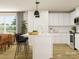 Eat-in kitchen featuring a center island with bar seating and stainless steel appliances at 155 Astor St, Troutman, NC 28166