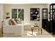 Cozy living room featuring a comfortable sectional sofa, stylish decor, and ample natural light at 155 Astor St, Troutman, NC 28166