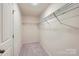 Spacious walk-in closet featuring ample shelving for optimal storage solutions at 155 Astor St, Troutman, NC 28166
