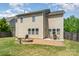 Inviting backyard with a stone fire pit and patio, ideal for outdoor entertaining at 15807 Foreleigh Rd, Huntersville, NC 28078