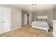 Cozy bedroom with neutral walls and carpet, featuring a comfortable bed and ample closet space at 15807 Foreleigh Rd, Huntersville, NC 28078