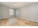 Clean and simple bedroom with neutral carpet, a window for natural light, and fresh paint at 15807 Foreleigh Rd, Huntersville, NC 28078