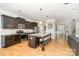 Well-equipped kitchen with granite countertops, stainless steel appliances, and central island with seating at 15807 Foreleigh Rd, Huntersville, NC 28078
