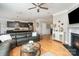 Open concept living room with fireplace seamlessly connects to the kitchen for easy entertaining at 15807 Foreleigh Rd, Huntersville, NC 28078