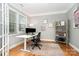 Bright office space with a large window, modern desk, and stylish decor, perfect for working from home at 15807 Foreleigh Rd, Huntersville, NC 28078